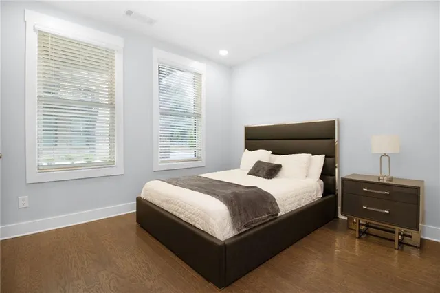 a bed room with a bed and a window