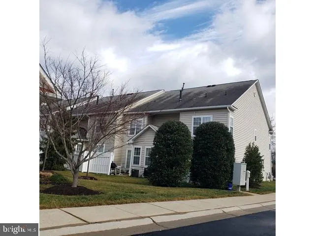 a view of house with yard