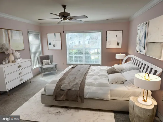 an empty room with windows and chandelier fan