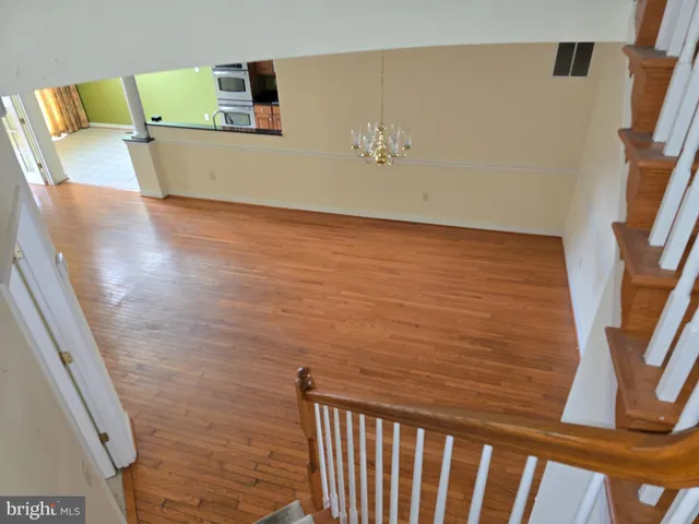 a bathroom with a double vanity sink a mirror and a bathtub