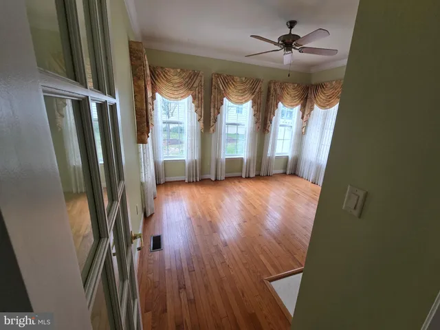 a view of gallery with wooden floor