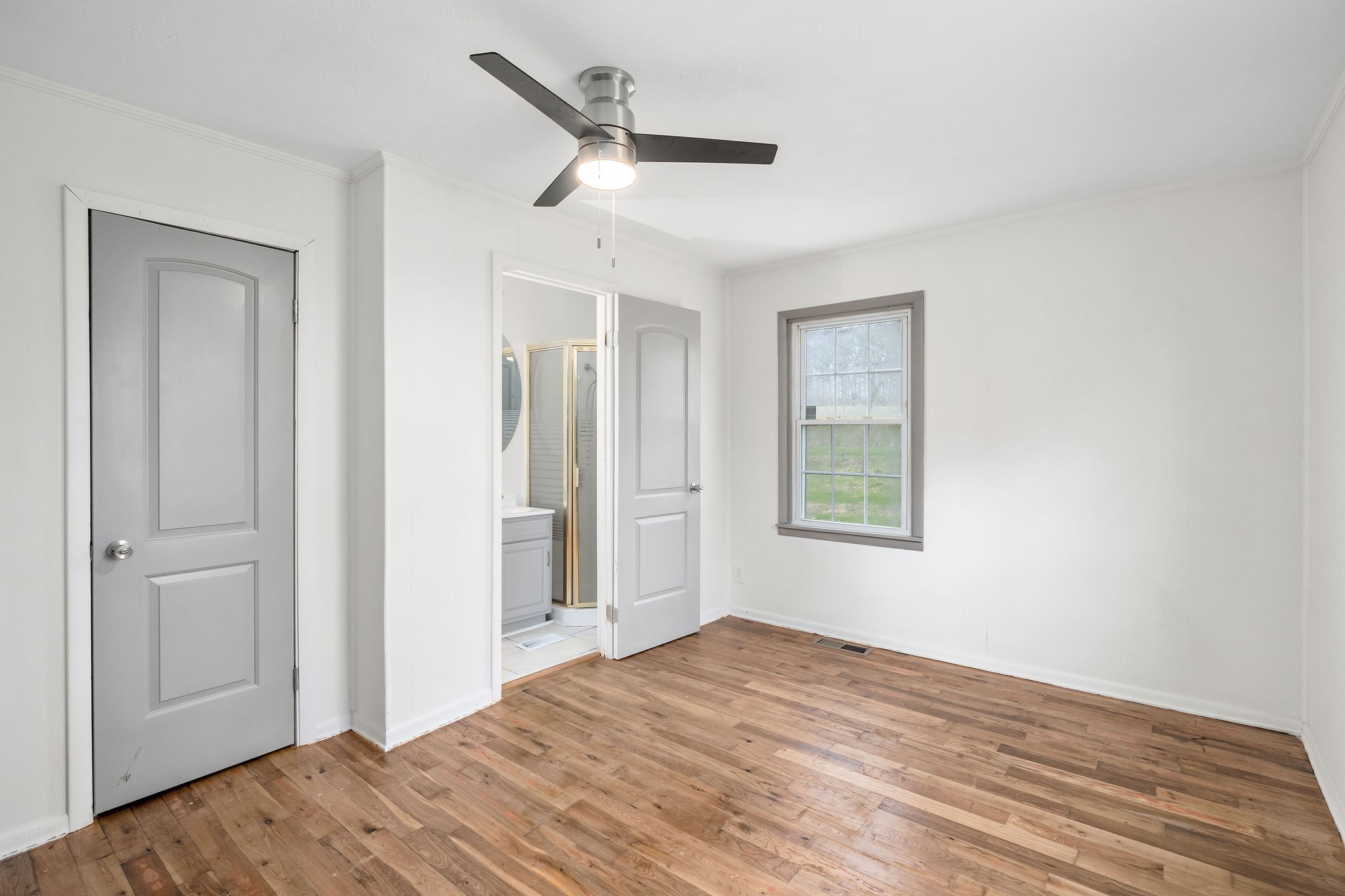 8626 Bockman Way Sparta, TN 38583 - Photo 20 of 25 a view of empty room with wooden floor and ceiling fan