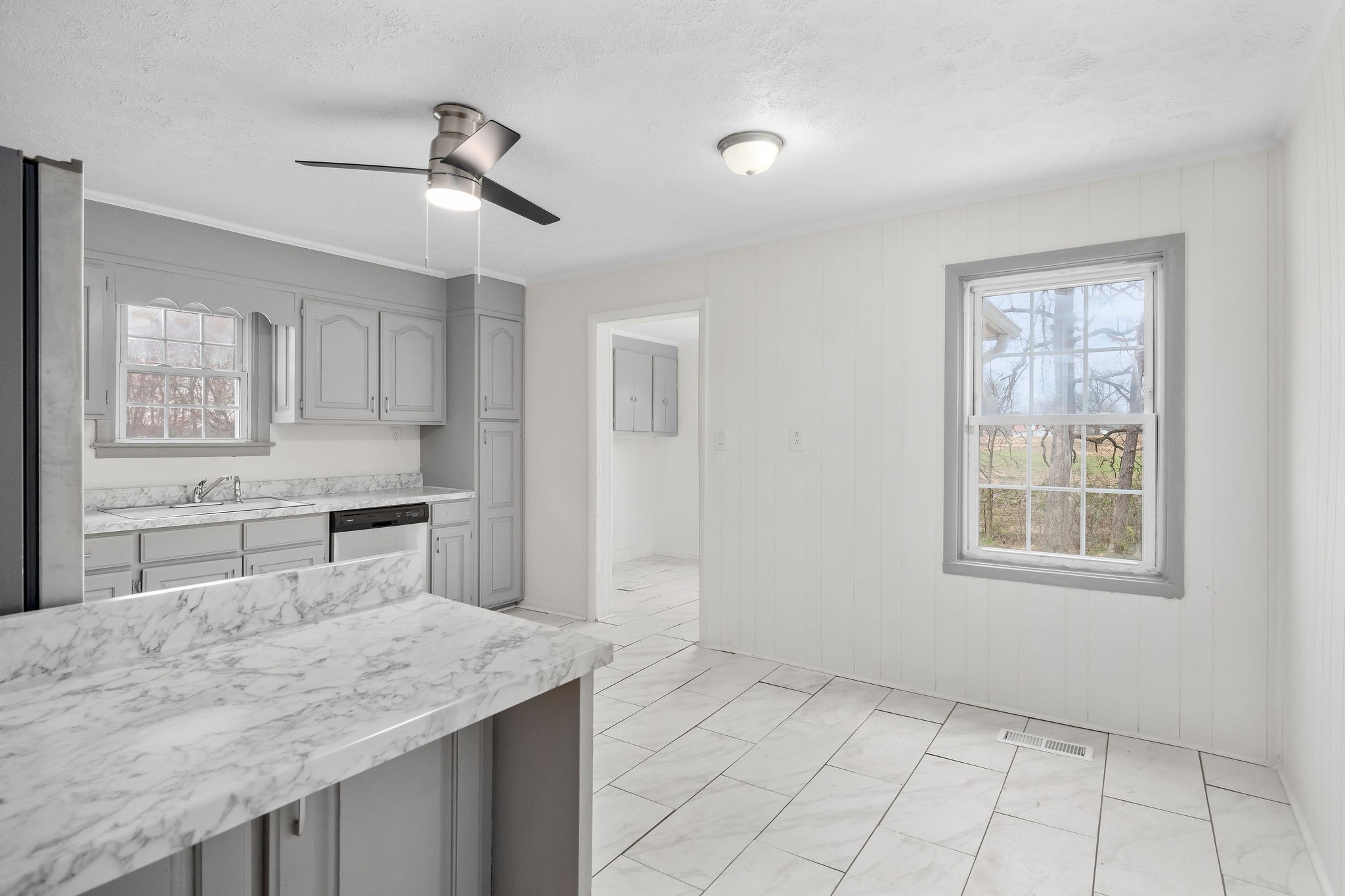 8626 Bockman Way Sparta, TN 38583 - Photo 8 of 25 a kitchen with granite countertop a sink cabinets and window