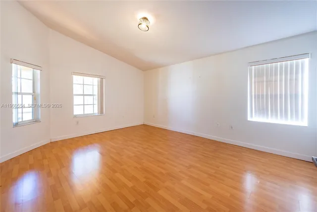 a bathroom with a shower and a sink