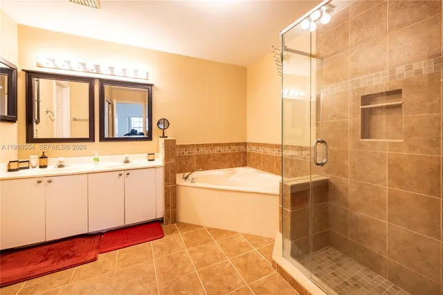 a bathroom with a sink toilet and a mirror