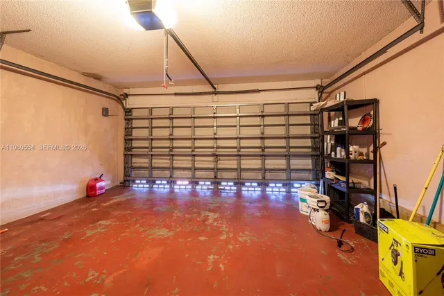 a utility room with closet dryer and washer