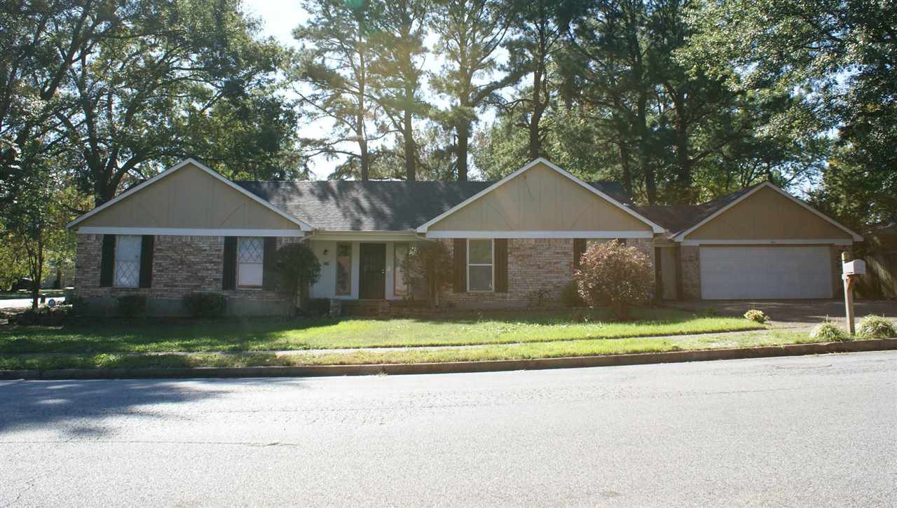 6205 Ridge Manor Drive Memphis, TN 38115 - Photo 1 of 8 a front view of a house with a yard and garage