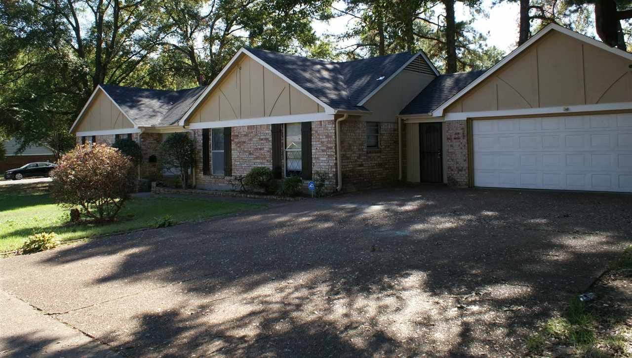 6205 Ridge Manor Drive Memphis, TN 38115 - Photo 2 of 8 a front view of a house with a yard and garage