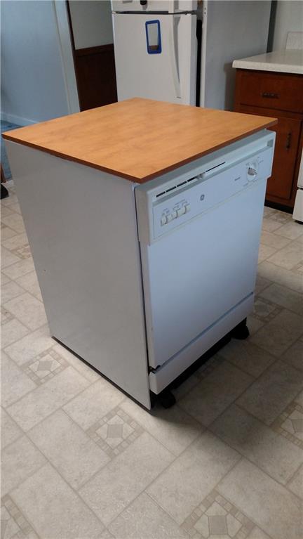Rolling island with dishwasher, load it, roll it and plug into the wall outlet!