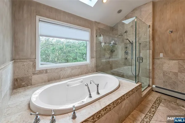 a bath tub sitting next to a window