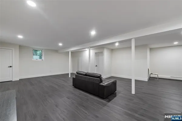 a view of a livingroom with furniture and wooden floor