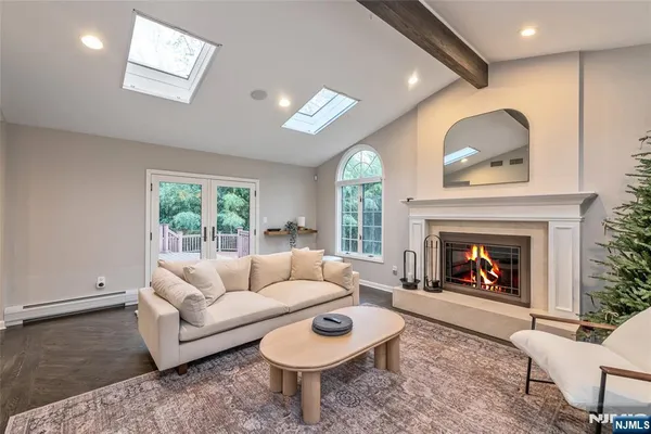 a living room with furniture and a fireplace