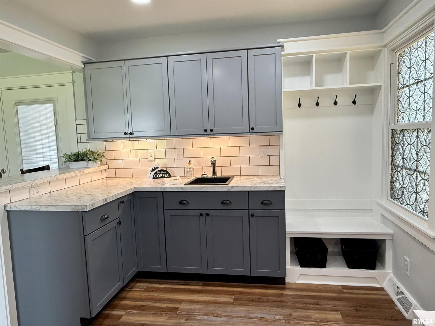 744 Airport Road Metropolis, IL 62960 - Photo 12 of 33 a kitchen with a sink and cabinets