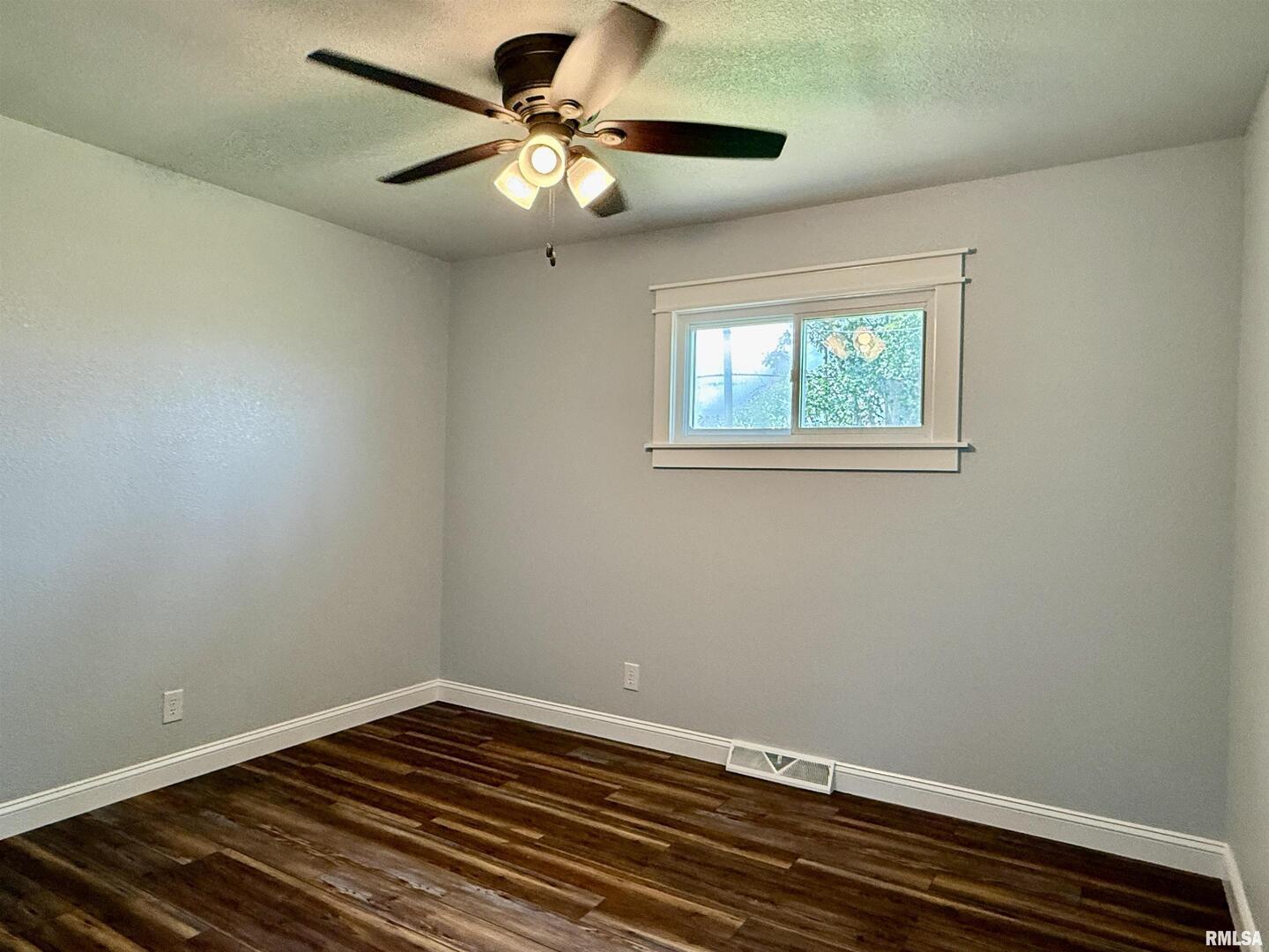 744 Airport Road Metropolis, IL 62960 - Photo 15 of 33 a view of a room with a ceiling fan and a window