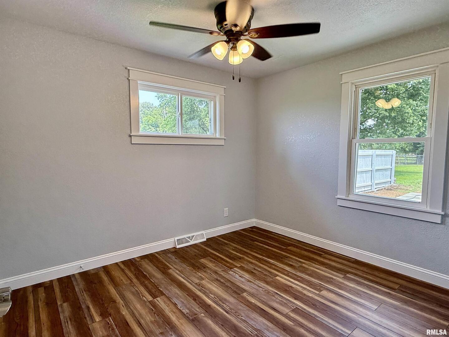744 Airport Road Metropolis, IL 62960 - Photo 24 of 33 a view of an empty room with window chandelier fan
