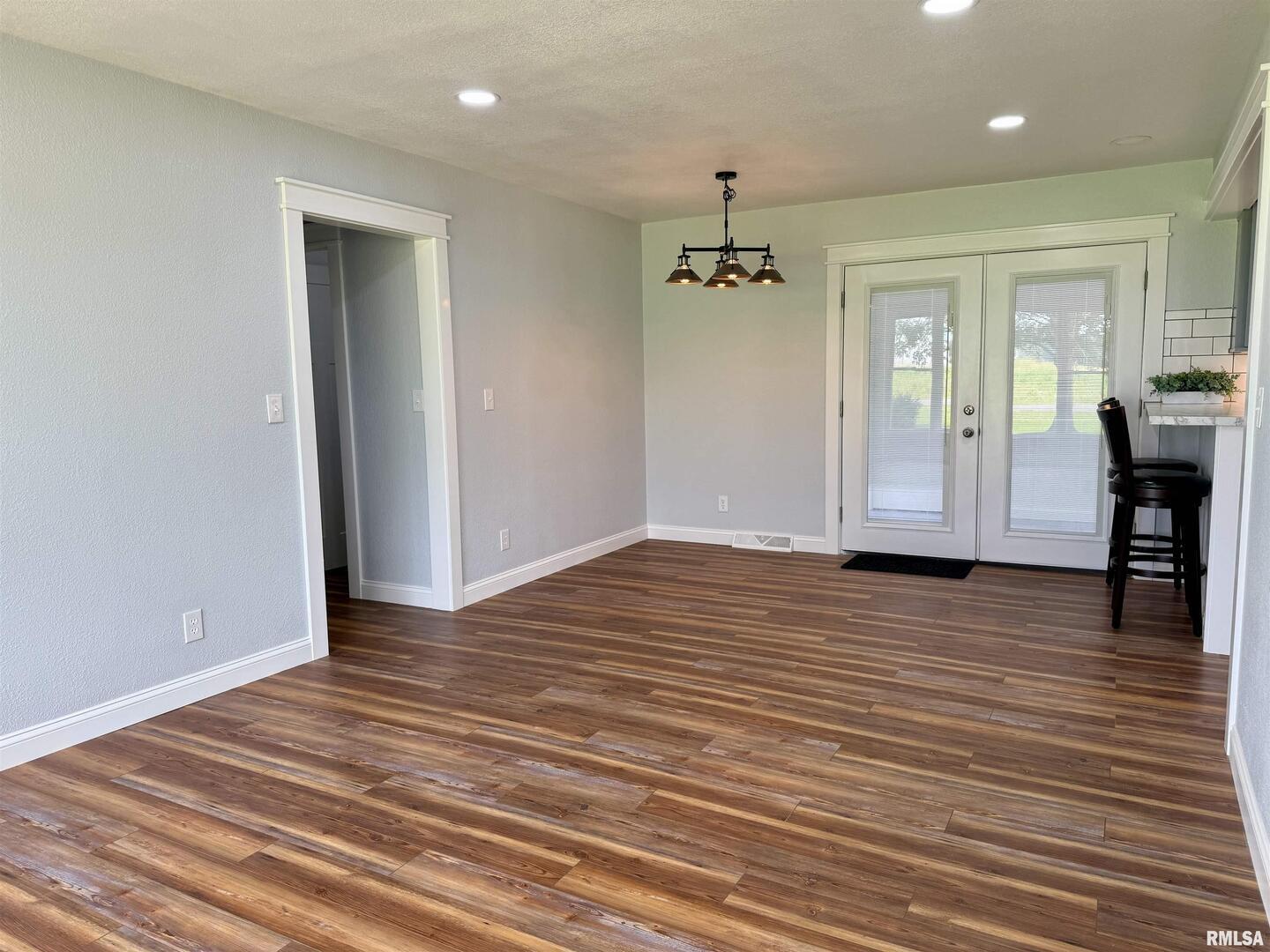 744 Airport Road Metropolis, IL 62960 - Photo 9 of 33 a view of empty room with wooden floor and window