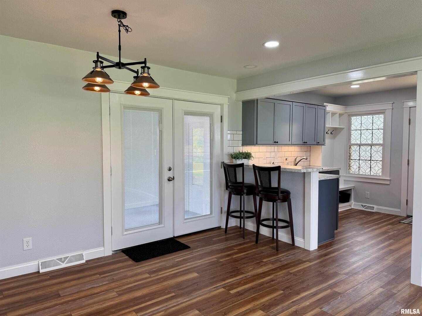 744 Airport Road Metropolis, IL 62960 - Photo 10 of 33 a view of a dining room with furniture window and wooden floor