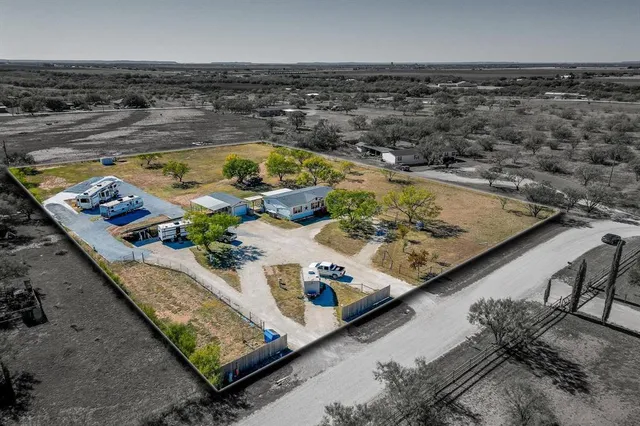a view of a swimming pool with furniture