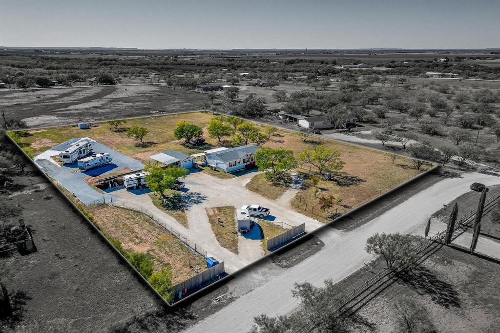 a view of a swimming pool with furniture