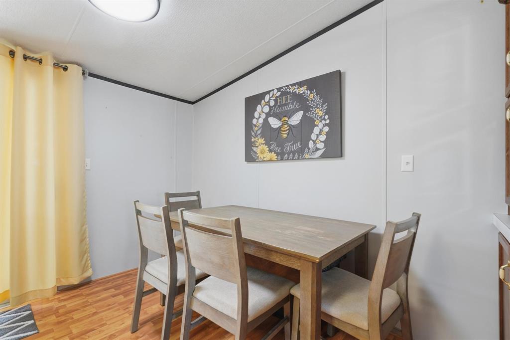 20082 County Road 304 Abilene, TX 79601 - Photo 11 of 36 a view of a dining room with furniture and wooden floor