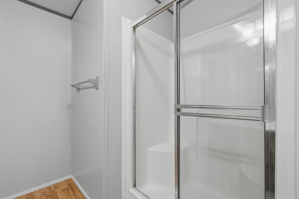 20082 County Road 304 Abilene, TX 79601 - Photo 16 of 36 a bathroom with a glass shower door