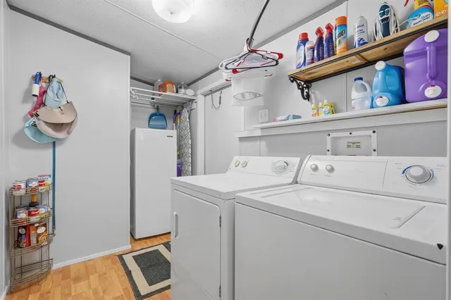 a view of a livingroom with furniture and hardwood floor