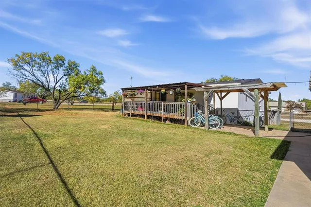 a view of a swimming pool with an outdoor space and seating area