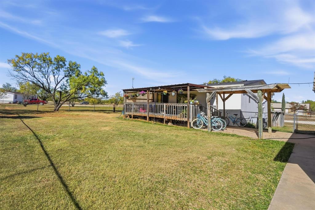20082 County Road 304 Abilene, TX 79601 - Photo 25 of 36 a view of a swimming pool with an outdoor space and seating area