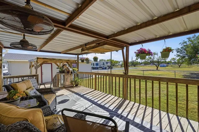 a view of balcony with furniture
