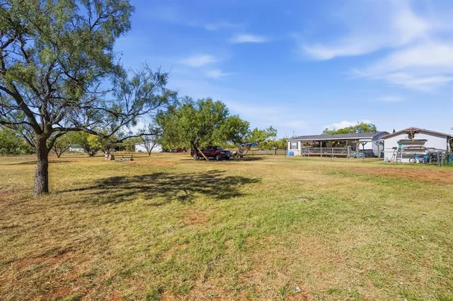 a view of a swimming pool with outdoor seating