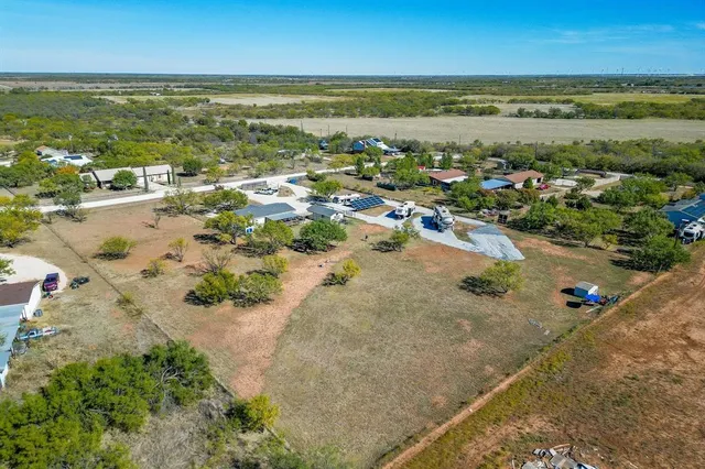 an aerial view of a house with outdoor space