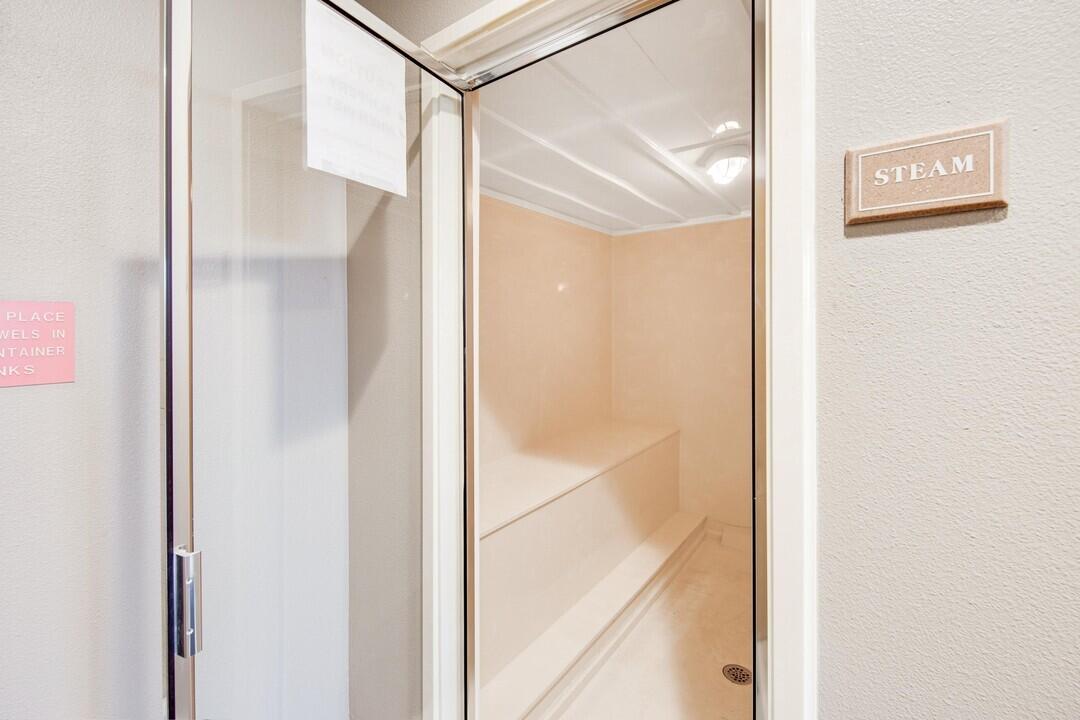 15 Chivas Lane, Unit 303A Santa Rosa Beach, FL 32459 - Photo 58 of 62 a bathroom with a glass shower door and a mirror