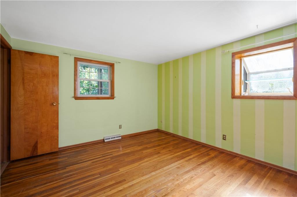 206 Hillendale Road Pittsburgh, PA 15237 - Photo 14 of 30 a view of empty room with wooden floor and fan