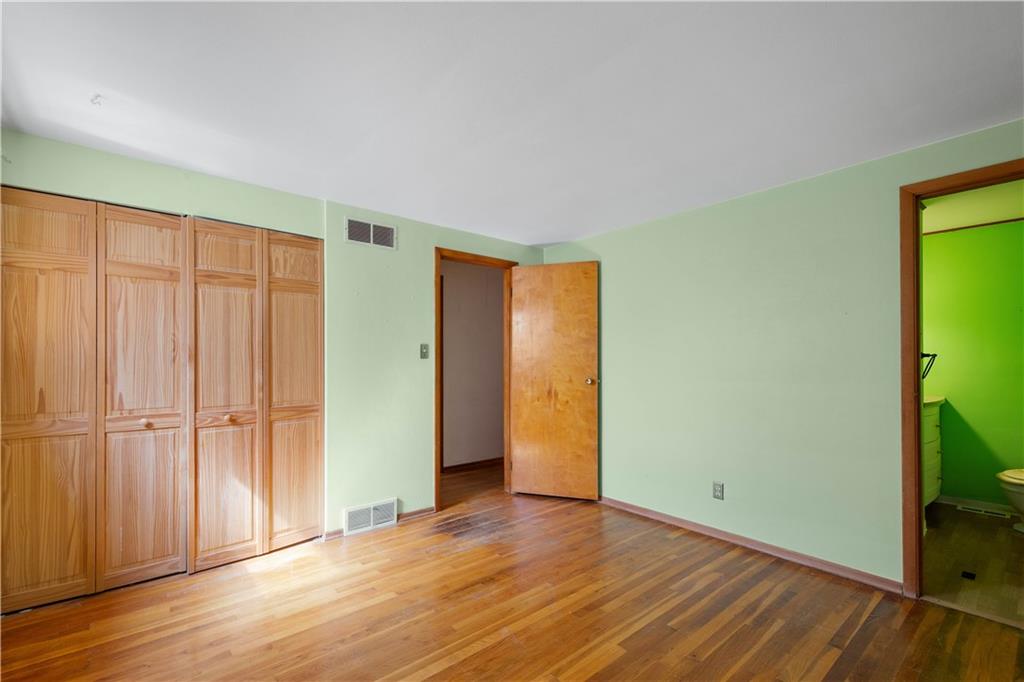 206 Hillendale Road Pittsburgh, PA 15237 - Photo 15 of 30 a view of an empty room with wooden floor and a window