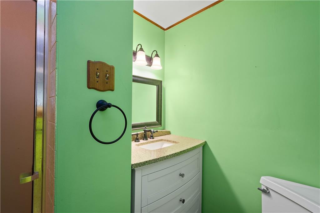 206 Hillendale Road Pittsburgh, PA 15237 - Photo 16 of 30 a bathroom with a toilet sink and mirror