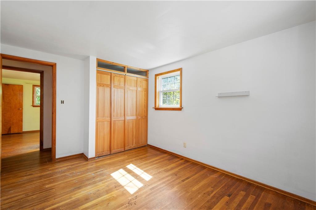 206 Hillendale Road Pittsburgh, PA 15237 - Photo 18 of 30 a view of empty room with wooden floor and fan