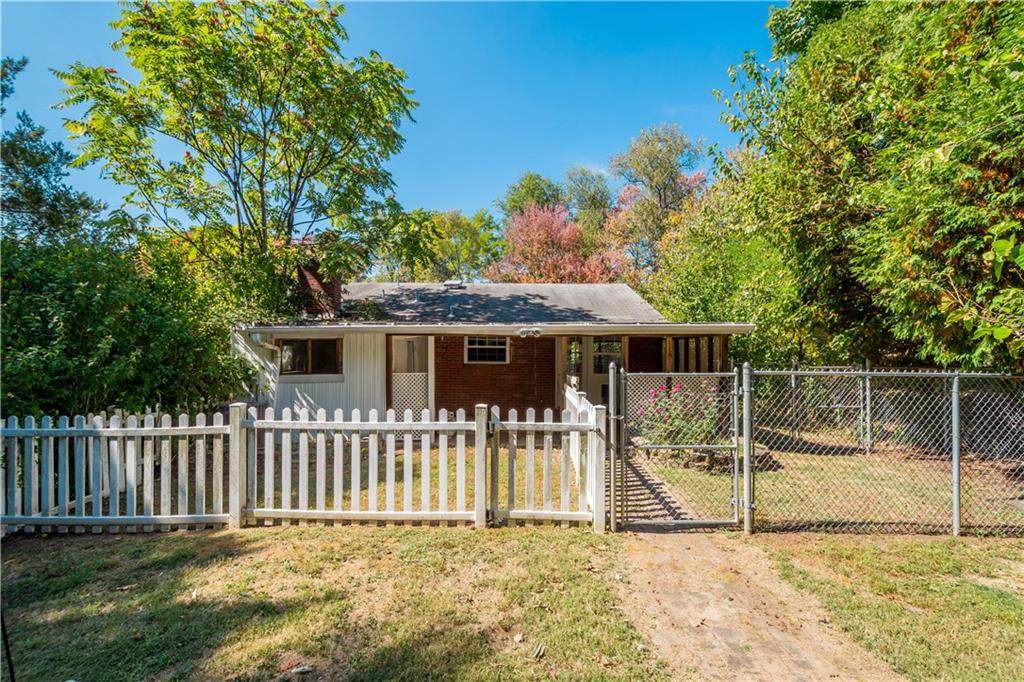 206 Hillendale Road Pittsburgh, PA 15237 - Photo 26 of 30 a white house that has a small yard and wooden fence