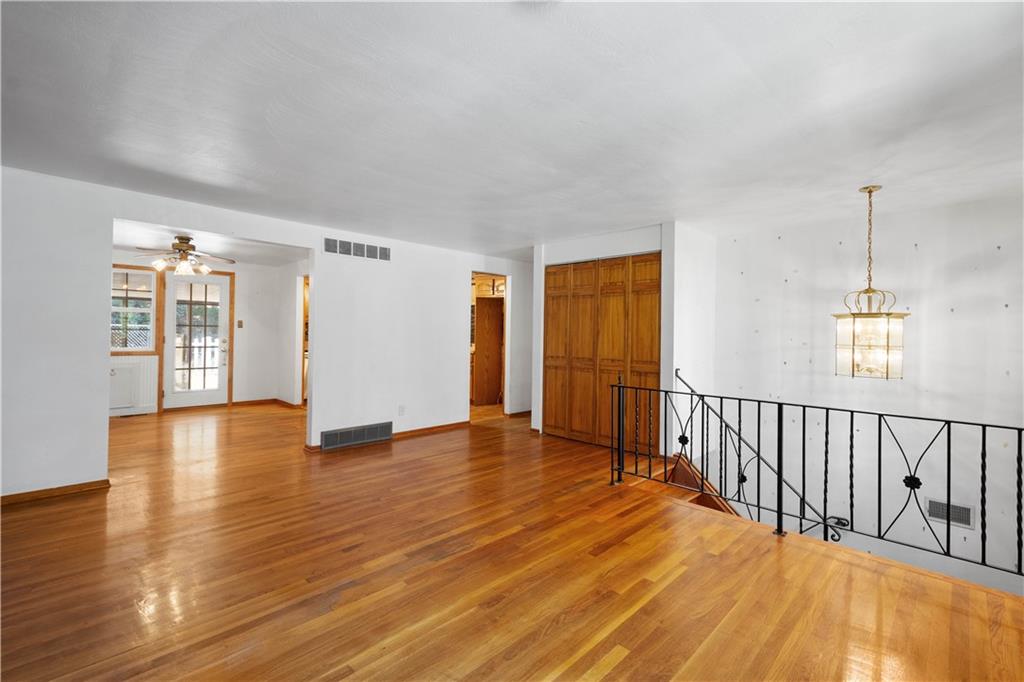 206 Hillendale Road Pittsburgh, PA 15237 - Photo 6 of 30 a view of a room with wooden floor and stairs