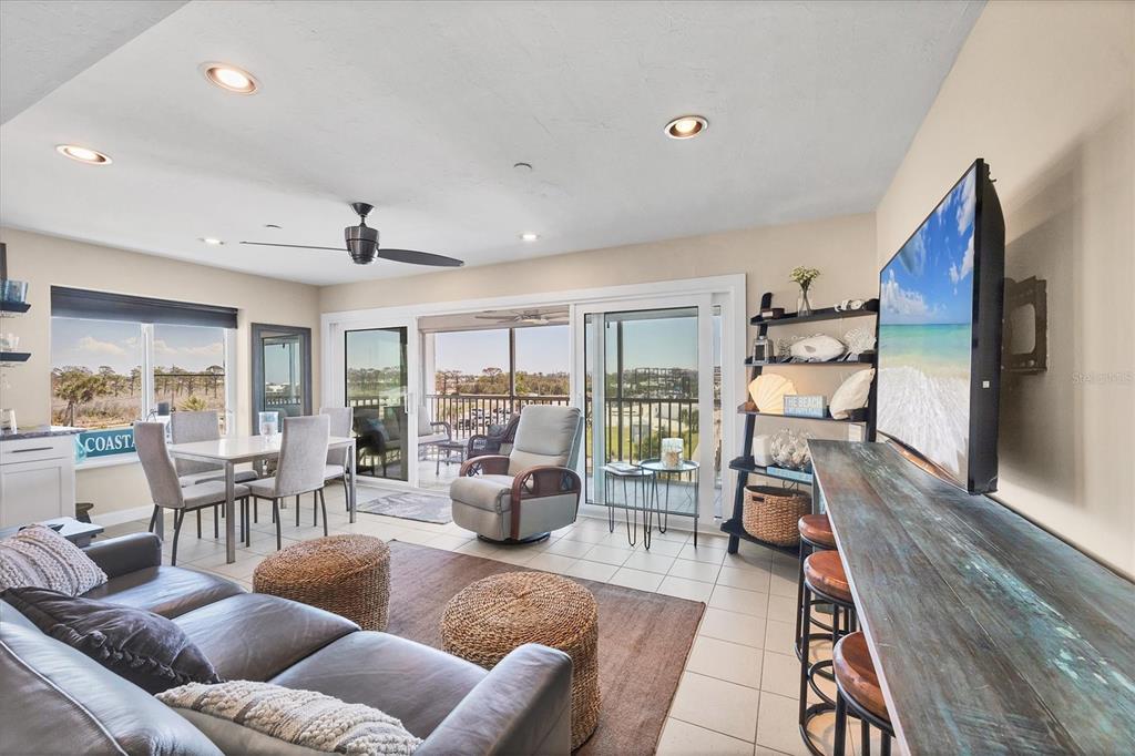 7070 Placida Road, Unit 1230 Placida, FL 33946 - Photo 13 of 60 a living room with furniture and a wooden floor