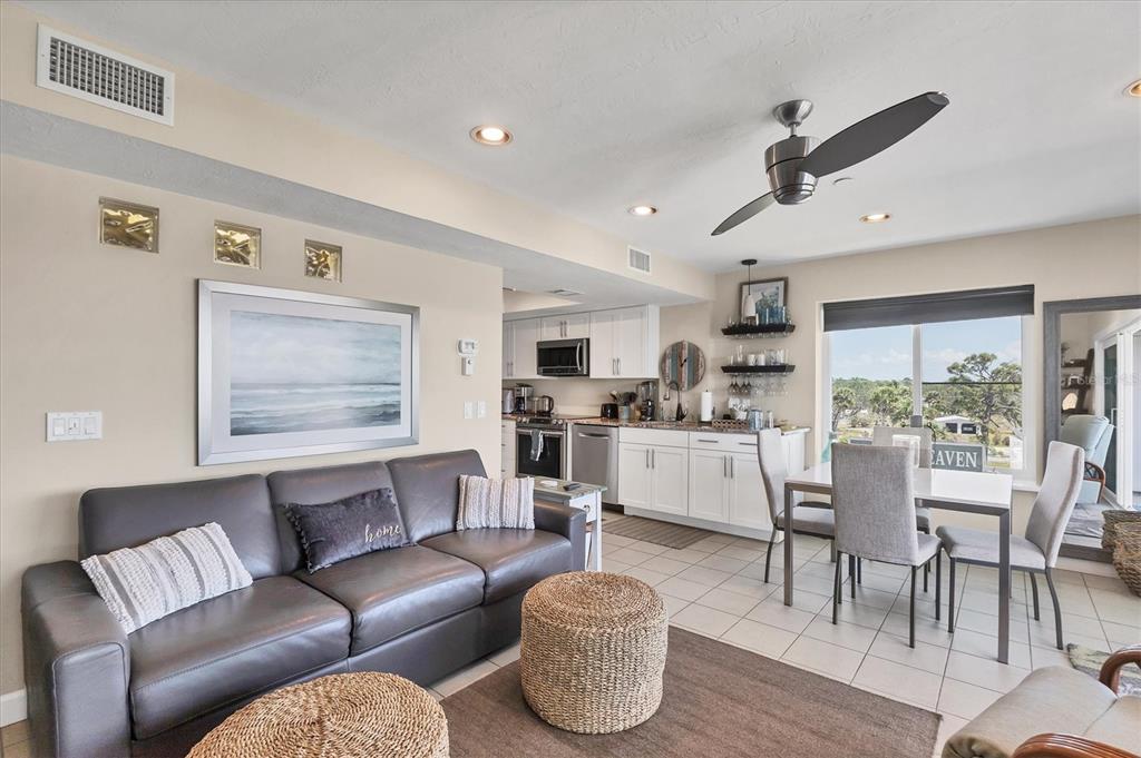 7070 Placida Road, Unit 1230 Placida, FL 33946 - Photo 14 of 60 a living room with furniture and a large window