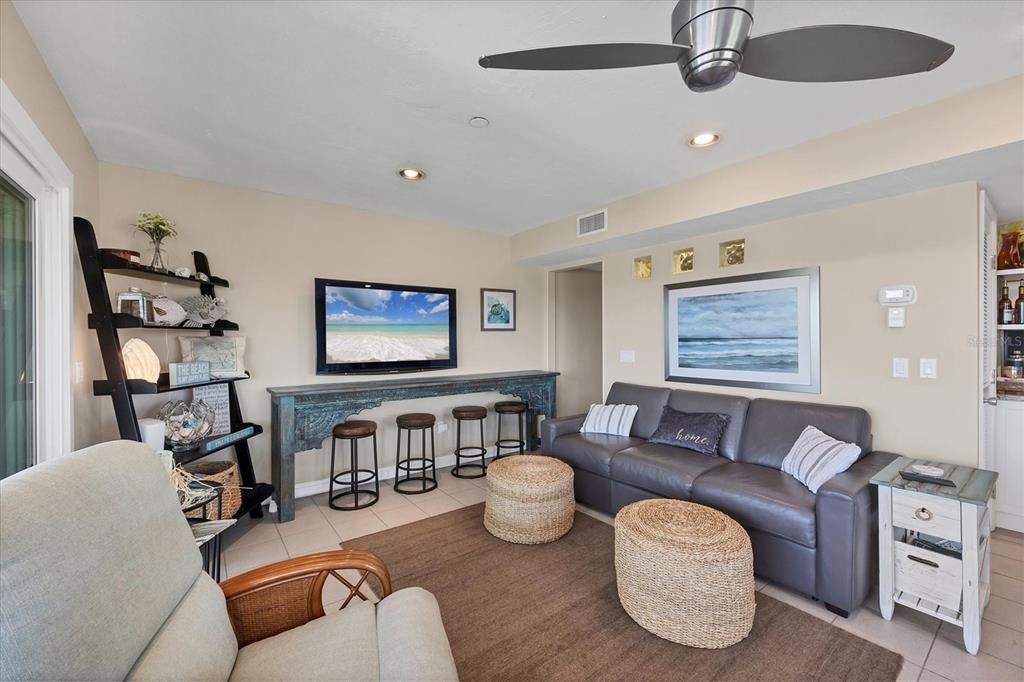 7070 Placida Road, Unit 1230 Placida, FL 33946 - Photo 16 of 60 a living room with furniture and a flat screen tv