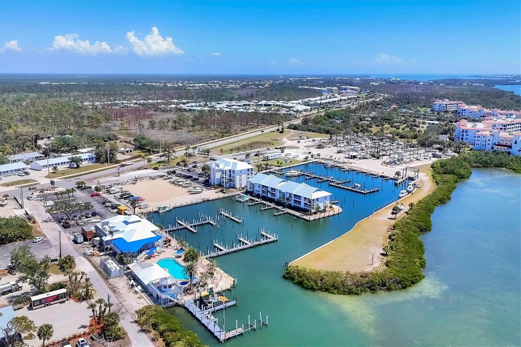 7070 Placida Road, Unit 1230 Placida, FL 33946 - Photo 2 of 60 an aerial view of residential houses with outdoor space