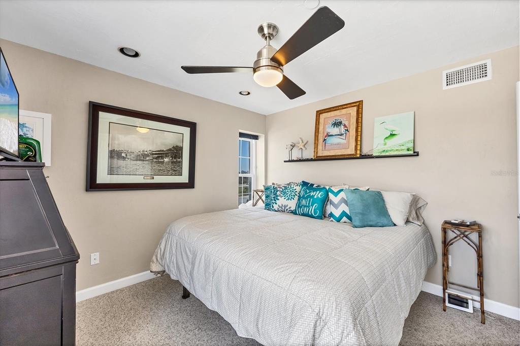 7070 Placida Road, Unit 1230 Placida, FL 33946 - Photo 28 of 60 a bedroom with a bed and a desk