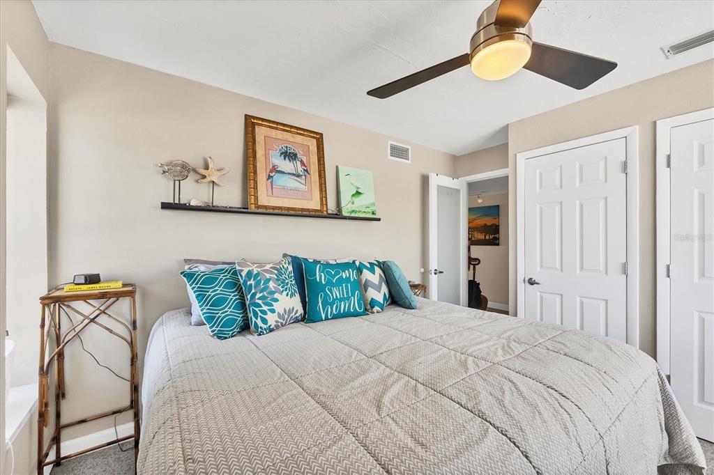 7070 Placida Road, Unit 1230 Placida, FL 33946 - Photo 29 of 60 a bedroom with a bed and table chair