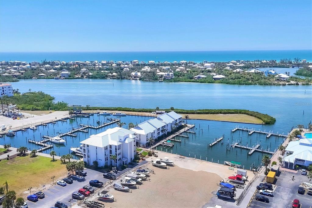 7070 Placida Road, Unit 1230 Placida, FL 33946 - Photo 3 of 60 an aerial view of a house with a lake view