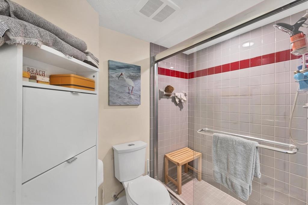 7070 Placida Road, Unit 1230 Placida, FL 33946 - Photo 34 of 60 a white toilet sitting next to a bathroom sink