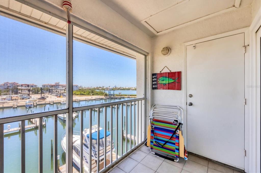 7070 Placida Road, Unit 1230 Placida, FL 33946 - Photo 37 of 60 a room that has a bed and a window