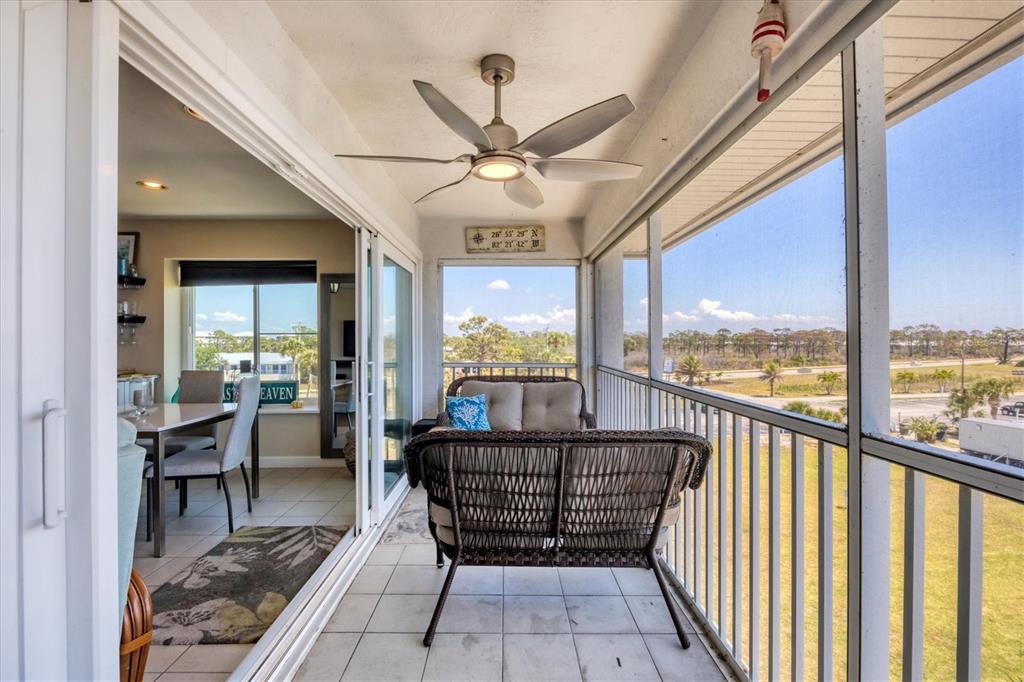 7070 Placida Road, Unit 1230 Placida, FL 33946 - Photo 39 of 60 a view of a balcony with furniture