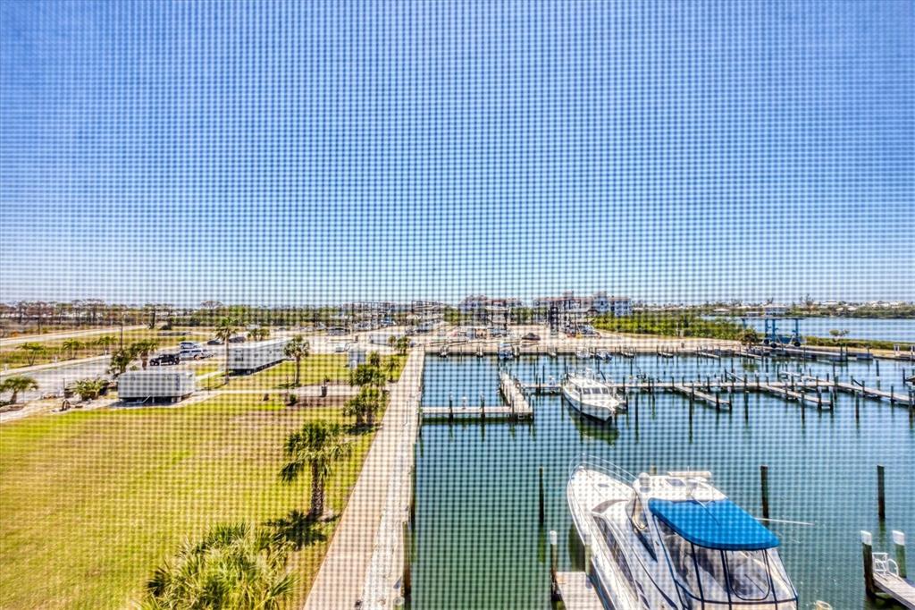 7070 Placida Road, Unit 1230 Placida, FL 33946 - Photo 43 of 60 a view of a swimming pool with outdoor seating