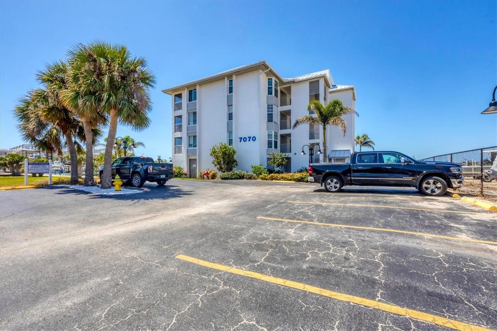7070 Placida Road, Unit 1230 Placida, FL 33946 - Photo 6 of 60 a car parked in front of a building